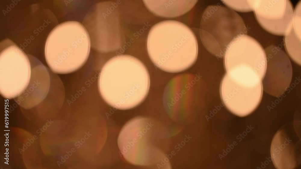 Beautiful glittering bokeh round shape in a dark background at night. It reflects the romantic capital lifestyle. Abstract concept. Beautiful glittering bokeh round shape in a dark background at night. It reflects the romantic capital lifestyle. Abstract concept.