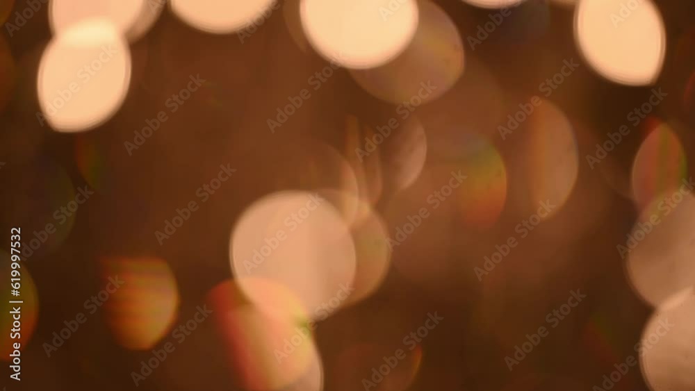 Beautiful glittering bokeh round shape in a dark background at night. It reflects the romantic capital lifestyle. Abstract concept. Beautiful glittering bokeh round shape in a dark background at night. It reflects the romantic capital lifestyle. Abstract concept.