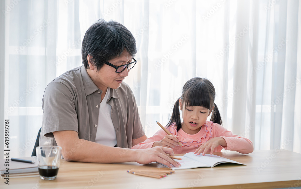 Portrait of father and daughter learning to write, daddy teaching little girl homework isolated on white background, Education study home school father's day concept banner Portrait of father and daughter learning to write, daddy teaching little girl homework isolated on white background, Education study home school father's day concept banner