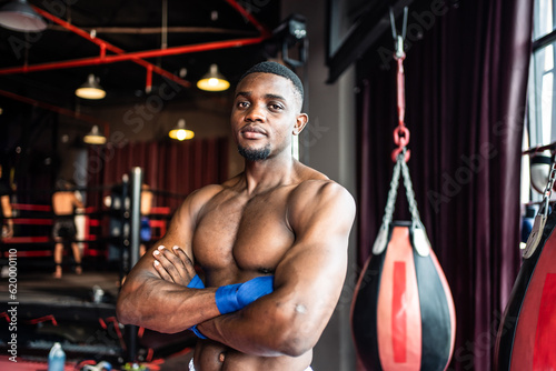 Portrait African professional sport young man exercising in fitness. 