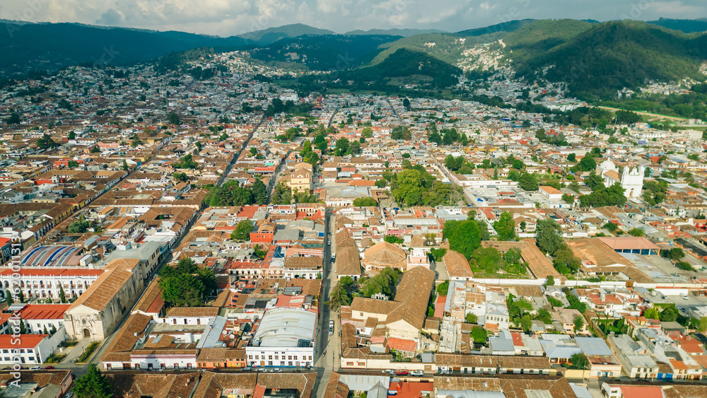 Beautiful aerial view of the rooftops of the old colonial buildings in the city of san cristobal de las Casas on the sunset