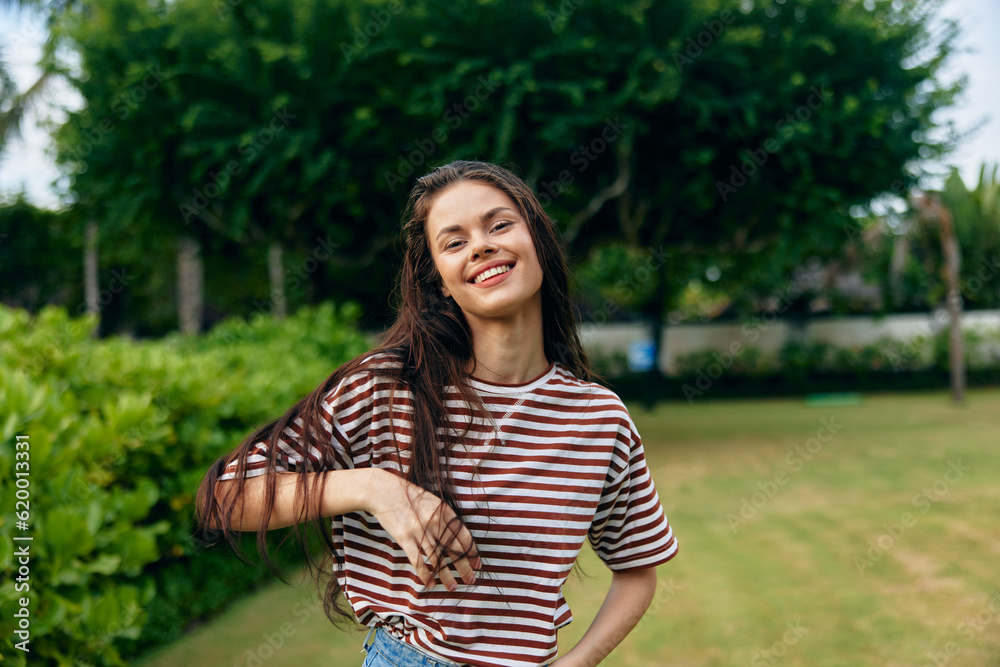 Fototapeta premium summer woman walk t-shirt freedom beautiful nature smiling wellness lifestyle park