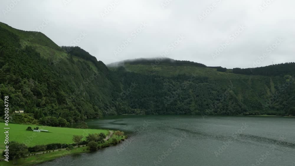 Flying over Lagoa Azul in Sao Miguel island of the Azores on a misty, moody day. Flying over Lagoa Azul in Sao Miguel island of the Azores on a misty, moody day.