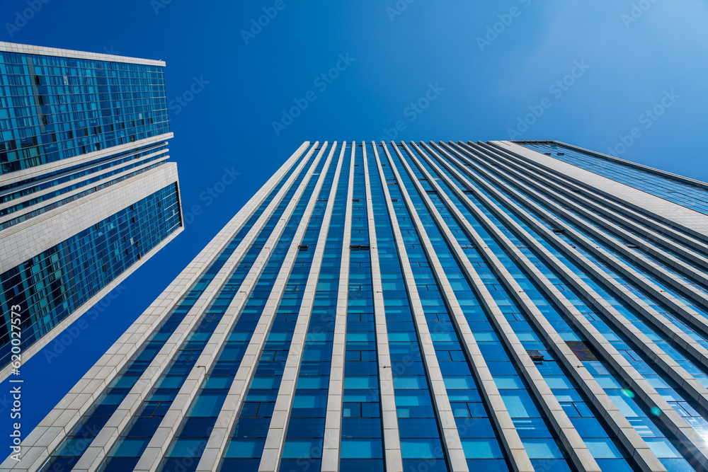 Looking up at a modern city office building Looking up at a modern city office building