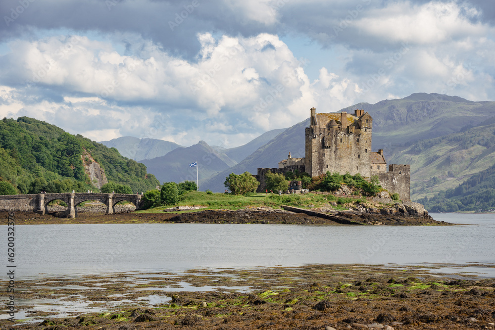 Eilean Donan Castle showcased on a picturesque cloudy day, embodying the charm of Scotland's scenic beauty.