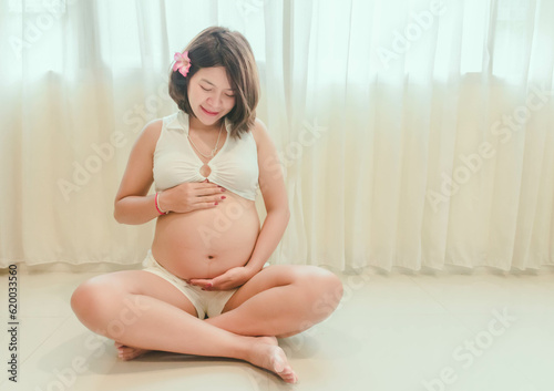 A woman who is 8 months pregnant with each verb.