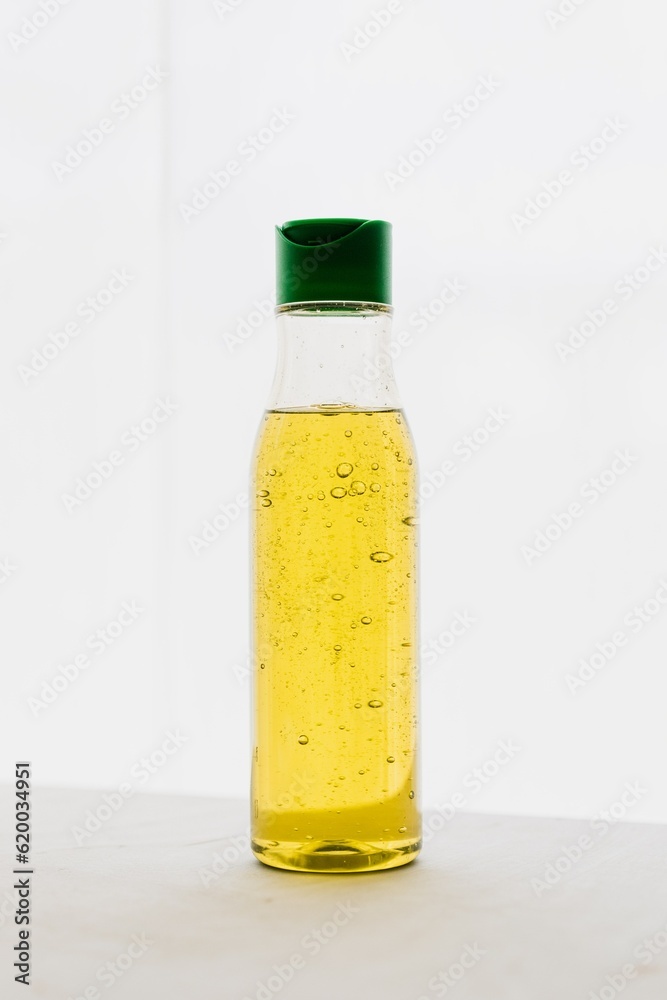 HD quality realistic cosmetic bottle without label placed on table HD quality realistic cosmetic bottle without label placed on table