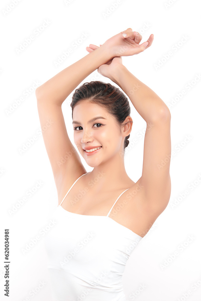 Beautiful Young Asian woman lifting hands up to show off clean and hygienic armpits or underarms on white background, Smooth armpit cleanliness and protection concept Beautiful Young Asian woman lifting hands up to show off clean and hygienic armpits or underarms on white background, Smooth armpit cleanliness and protection concept