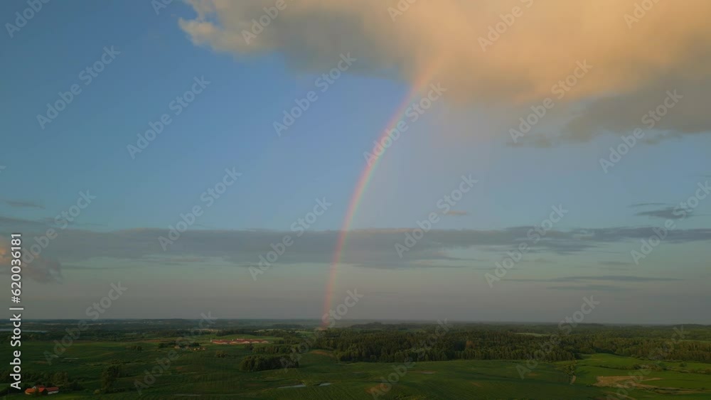 Aerial shot of the landscape from which the rainbow rises to the sky Aerial shot of the landscape from which the rainbow rises to the sky