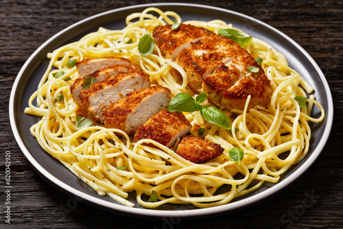 crusted chicken over lemon butter pasta, top view