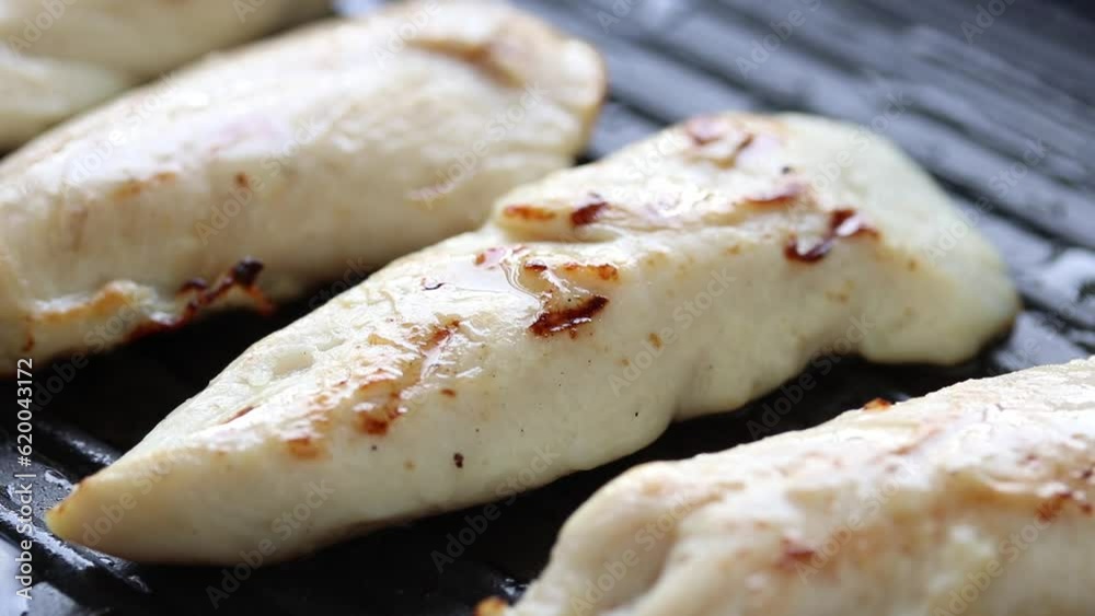 Close up of chicken breast steak in frying pan. Healthy food Close up of chicken breast steak in frying pan. Healthy food