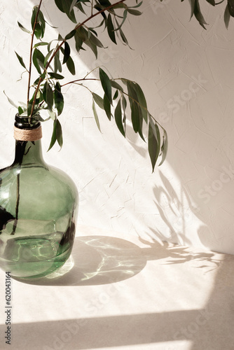 Quadro su tela Minimalist template for home room interior product, green vase with foliage on b