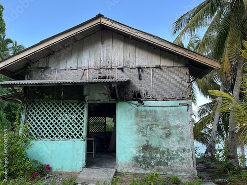 an old abandoned hut hangs on the edge of a ravine at Samadua, South Aceh, Indonesia  photo