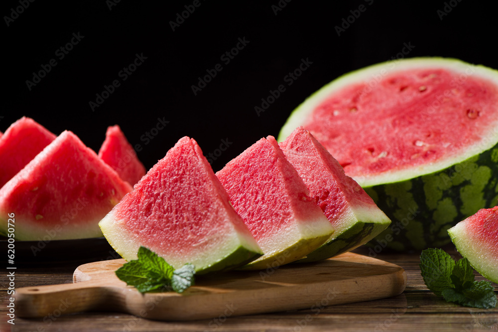 Fresh sliced watermelon on wooden background Fresh sliced watermelon on wooden background