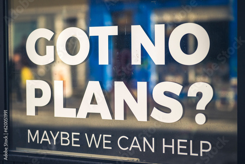 Text on a window, advertisement for people without plans