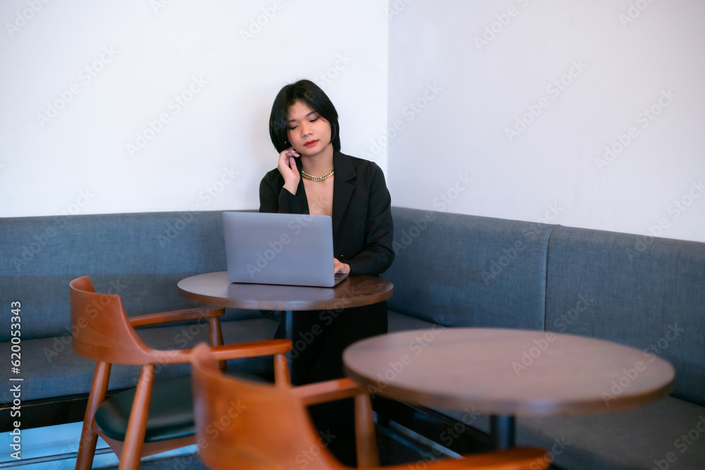 Portrait of asian freelance people businesswoman casual working with laptop computer in cafe interior in coffee shop background,business expressed confidence embolden and successful concept Portrait of asian freelance people businesswoman casual working with laptop computer in cafe interior in coffee shop background,business expressed confidence embolden and successful concept