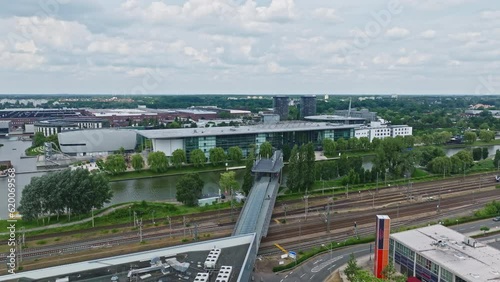 Drone shot of a modern glass building in autostadt , Wolfsburg , Germany photo