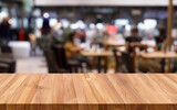 Table with blurred restaurant background MADE OF AI