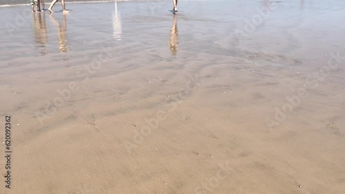 Young and fit girl running to the sea in caparica beach photo