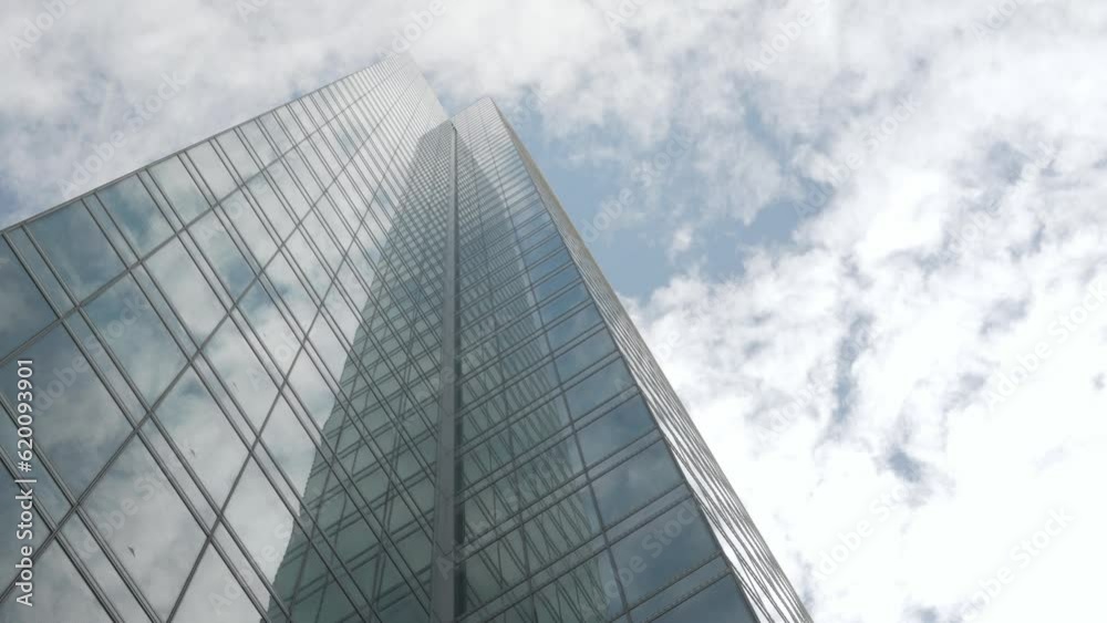 Modern office high rise skyscraper financial buildings in city business district. Looking up at modern glasses financial modern buildings up to sky with clear sky Modern office high rise skyscraper financial buildings in city business district. Looking up at modern glasses financial modern buildings up to sky with clear sky