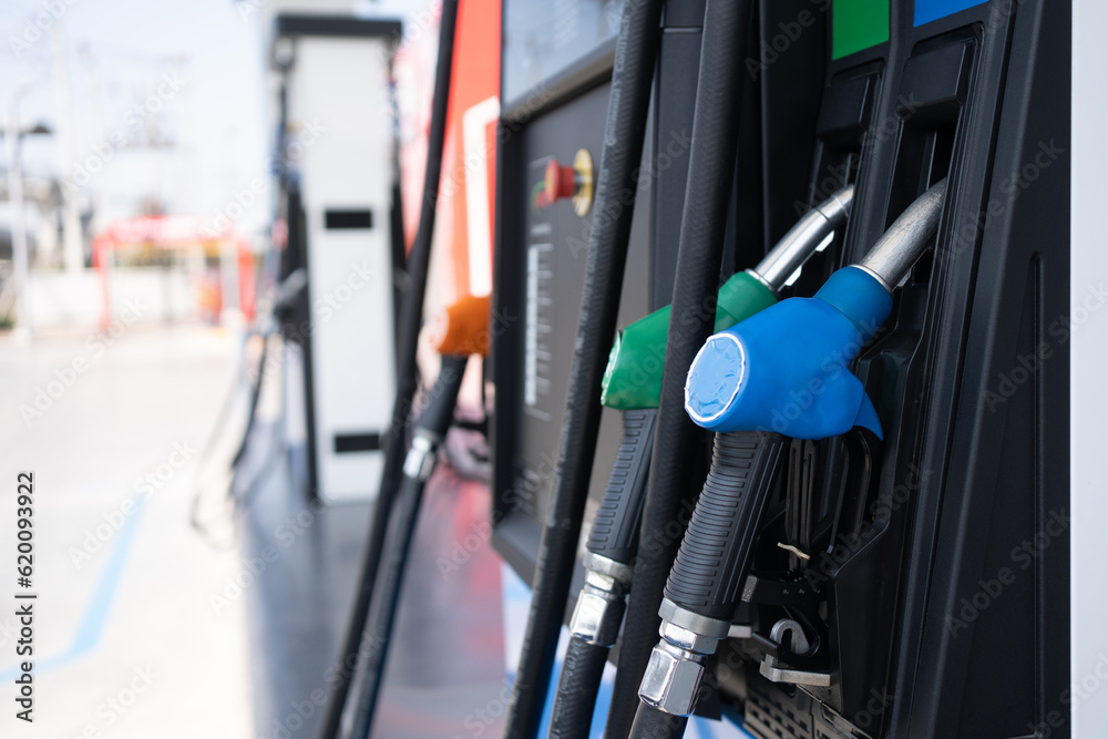 Gas pump nozzle in petrol station. Fuel dispenser machine.