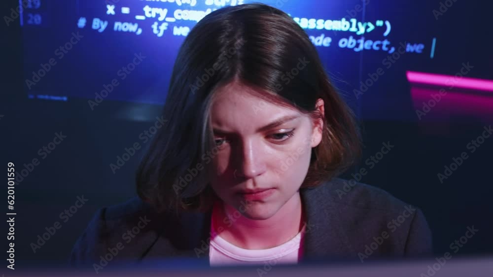 Attentie young girl, student, web, software developer working with computer, writing code. Innovative display with coding information. Concept of profession, occupation , IT, modern technologies Attentie young girl, student, web, software developer working with computer, writing code. Innovative display with coding information. Concept of profession, occupation , IT, modern technologies