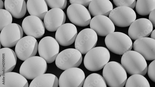 Many eggs rotate on a black background