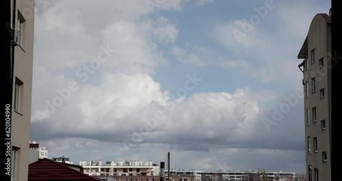 white clouds float across the blue sky