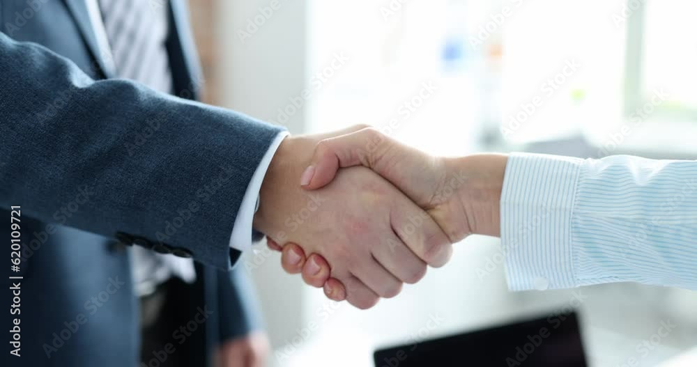 Closeup of business partners handshake in office 4k movie slow motion. Profitable deals concept Closeup of business partners handshake in office 4k movie slow motion. Profitable deals concept