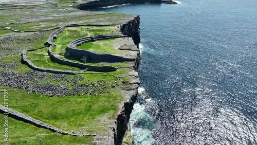 Drone flying along the cliff edge at Dun Angus Inis More Aran Islands Ireland on a fantastic May Day