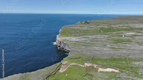 Drone establishing shot of Dun Angus Fort Inis More Aran Islands on the West Coast of Ireland perched high above the Atlantic Ocean photo