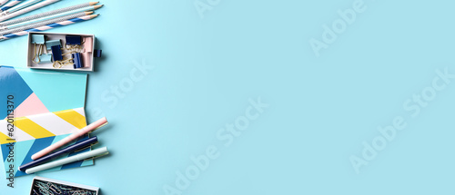 Set of office stationery on light blue background with space for text