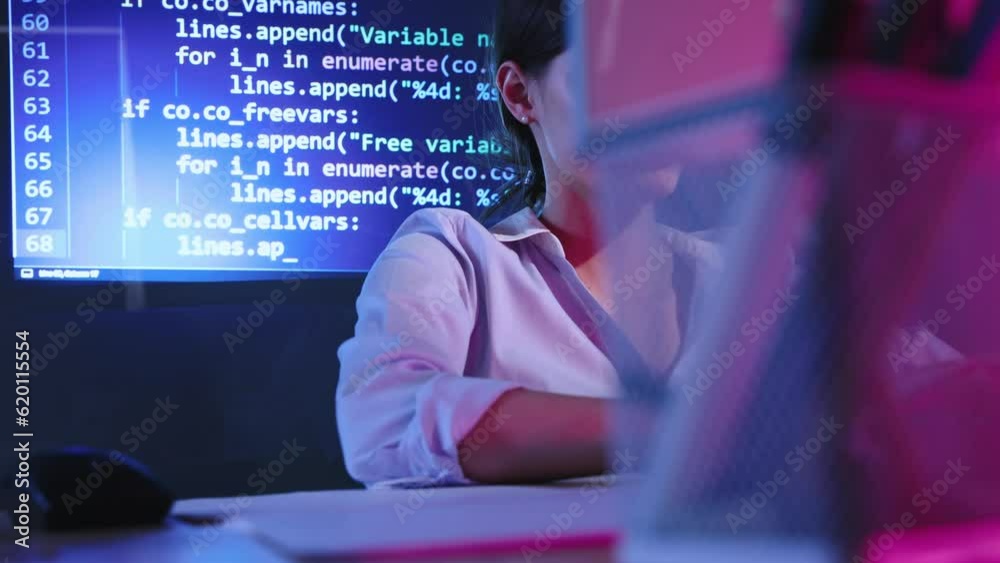 Young woman, programmer, web and app developer working on computer, writing programming code. Digital display, coding. Concept of profession, occupation , IT, modern technologies