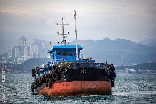 Large fishing boats docked by the sea in Hong Kong photo