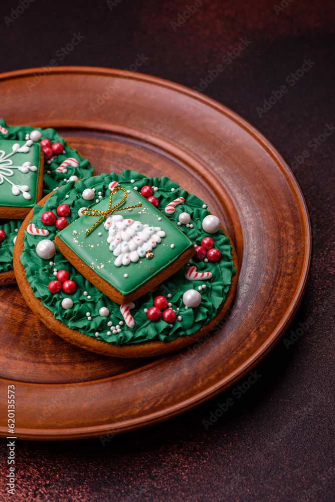 Beautiful delicious Christmas gingerbread on a concrete texture background