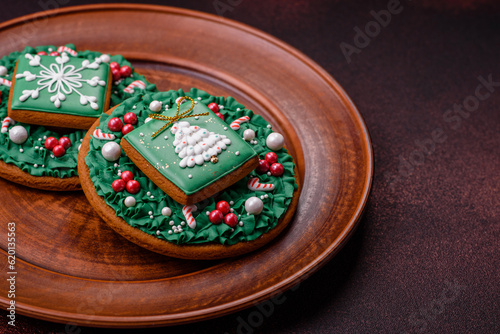 Beautiful delicious Christmas gingerbread on a concrete texture background
