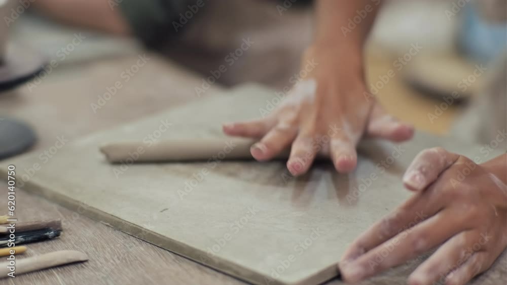 Close up of hand in process of sculpting clay figure Close up of hand in process of sculpting clay figure