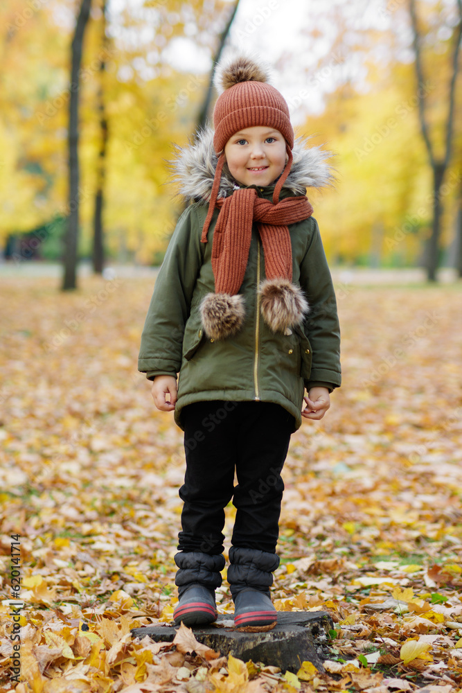 Cute happy little girl in autumn park Cute happy little girl in autumn park