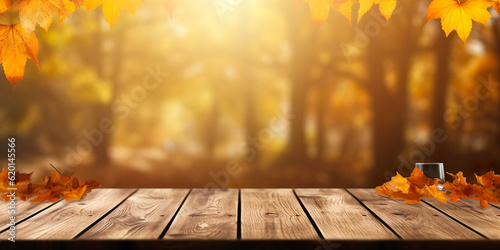 beautiful autumn background with an empty table and sunlight in the background