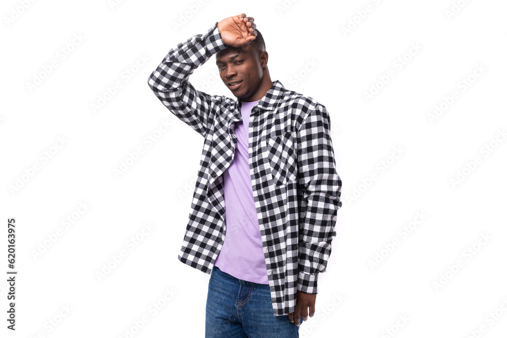 well-groomed pleasant young american guy with short hair dressed casually on a white background with copy space well-groomed pleasant young american guy with short hair dressed casually on a white background with copy space
