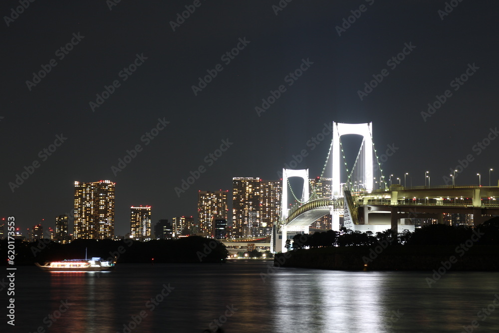 Night view of Odaiba Seaside Park and Rainbow Bridge in Tokyo, Japan Night view of Odaiba Seaside Park and Rainbow Bridge in Tokyo, Japan