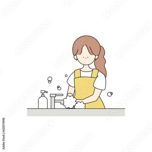 手を洗うエプロンの女の子