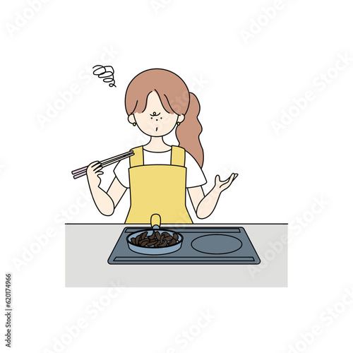 炒め物を焦がしてしまった女の子