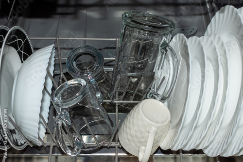 Clean dishes and glasses in the dishwasher