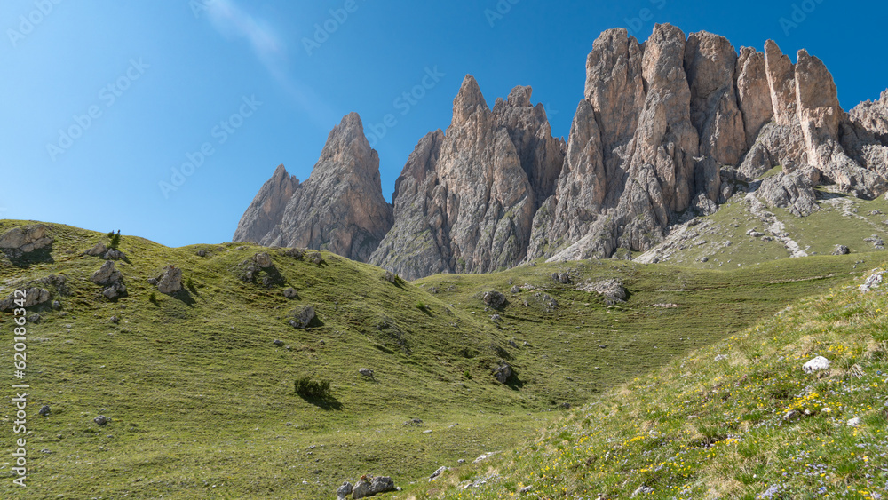 Green hilly meadows in front of the Geislerspitzen mountains (Gruppo delle Odle) in the Dolomites (Italian Alps) Green hilly meadows in front of the Geislerspitzen mountains (Gruppo delle Odle) in the Dolomites (Italian Alps)