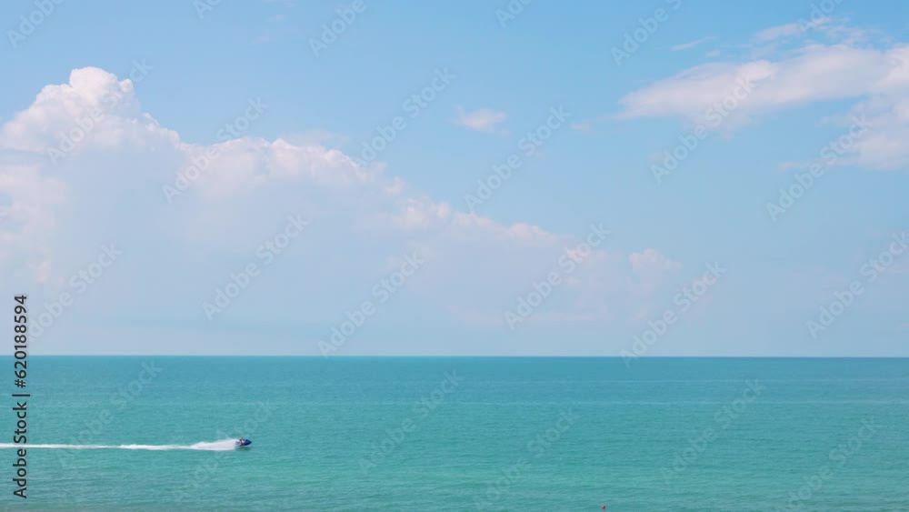 Aerial View Sea Horizon Blue Sky with White Clouds and Boat Floating on the Sea. Part Cloudy Sky Part Ocean on a Sunny Summer Day. Seascape. Aerial View Sea Horizon Blue Sky with White Clouds and Boat Floating on the Sea. Part Cloudy Sky Part Ocean on a Sunny Summer Day. Seascape.