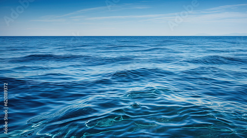 Calm sea on a clear day. Summer blue background