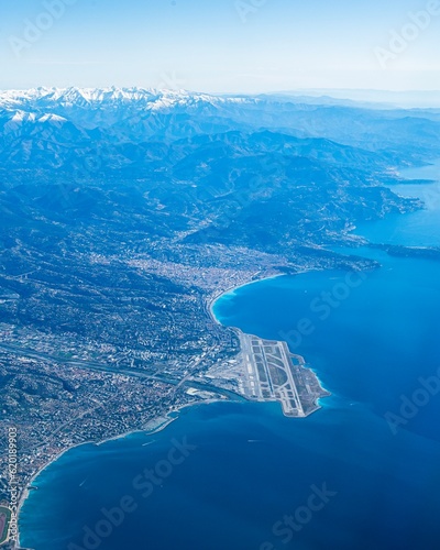 Amazing view of Nice Cote d'azur airport and Nice town along with the french riviera and the alps taken from an airplane window 