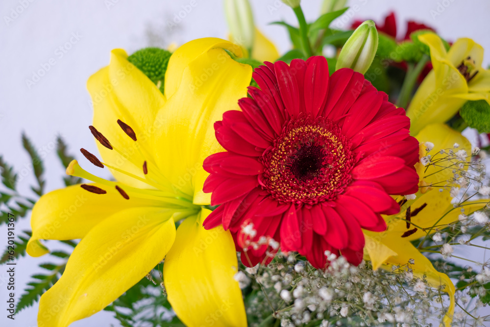 Valentine's Day Women's Day birthday celebration. Close up cropped photo of bouquet of flowers, red and yellow color