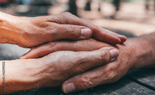 Old people holding hands close up view, senior retired family couple express care and psychological support concept, trust in happy marriage, empathy hope